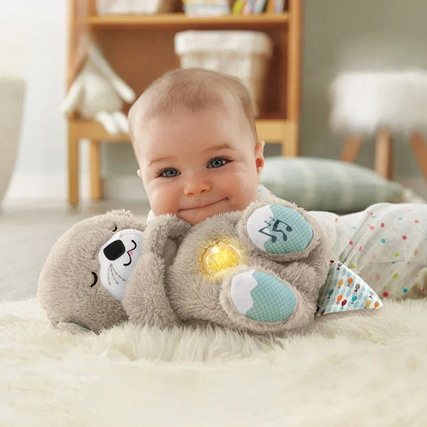 Baby with a soothing otter plush toy.